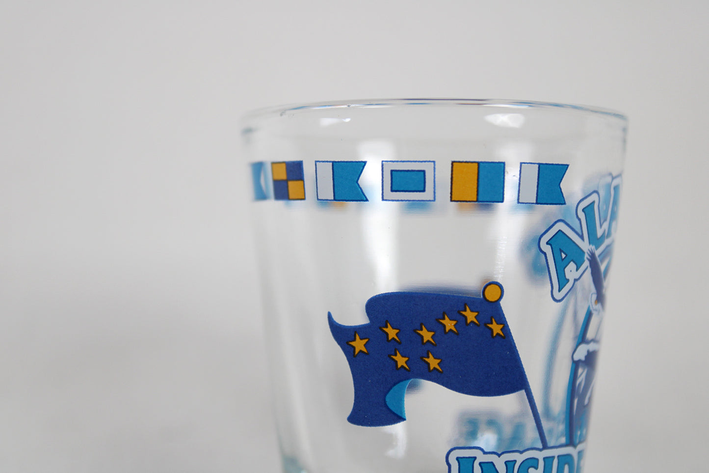 Alaska’s Inside Passage Shot Glass With State Flag And Semaphores