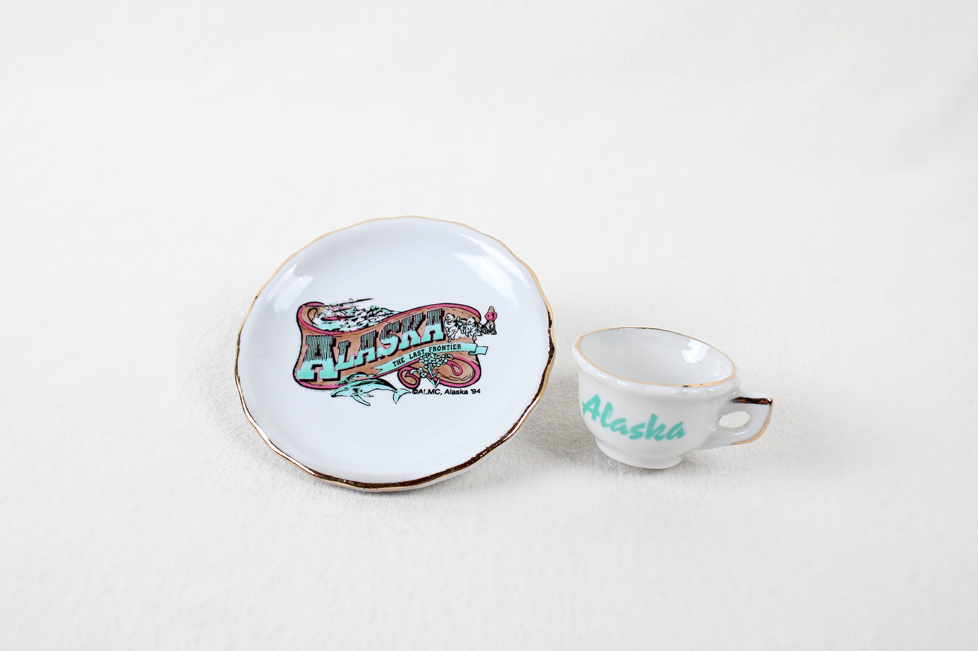 Alaska “The Last Frontier” Miniature Ceramic Cup And Saucer Decorative Set