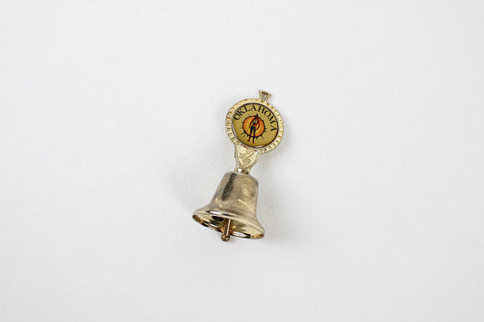 Oklahoma Metal Bell With Emblem Of Indian Warrior Against A Sun Symbol