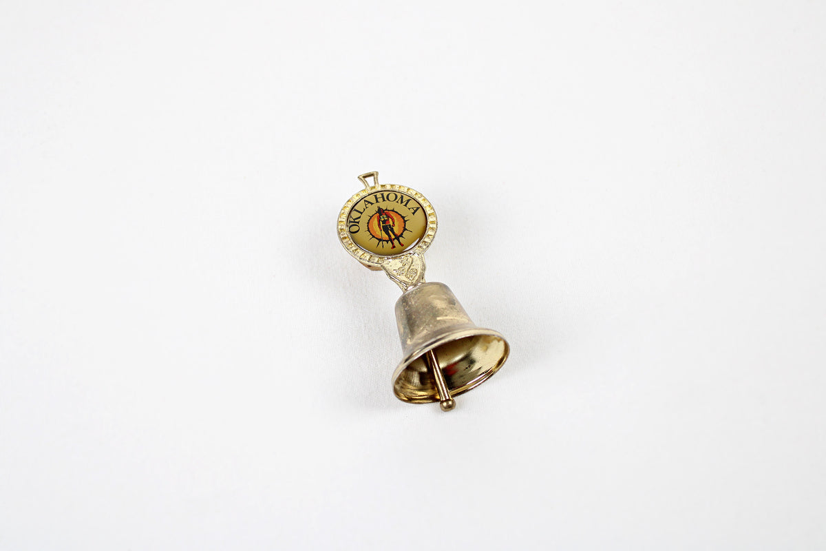 Oklahoma Metal Bell With Emblem Of Indian Warrior Against A Sun Symbol