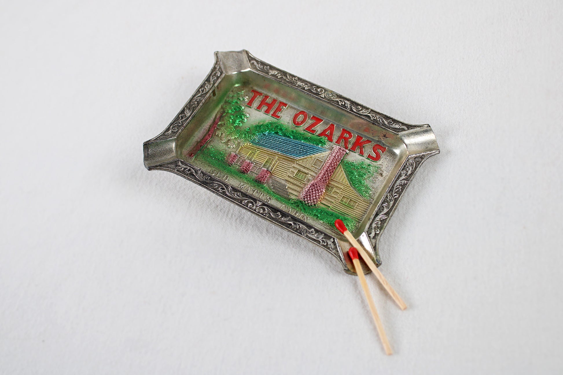 The Ozarks “Old Matt’s Cabin” Metal Ashtray Souvenir